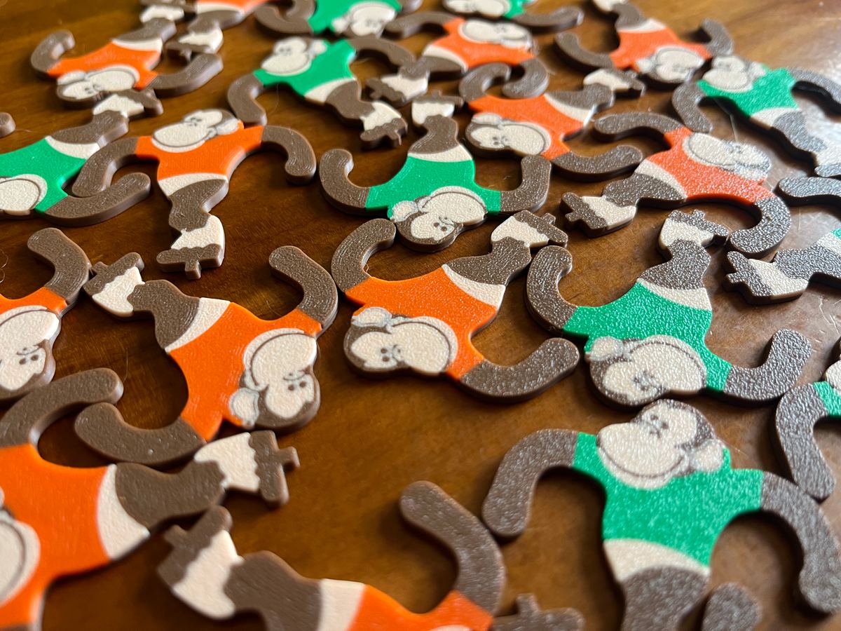Replacement plastic monkeys for a flip game, 3D printed for a toy library