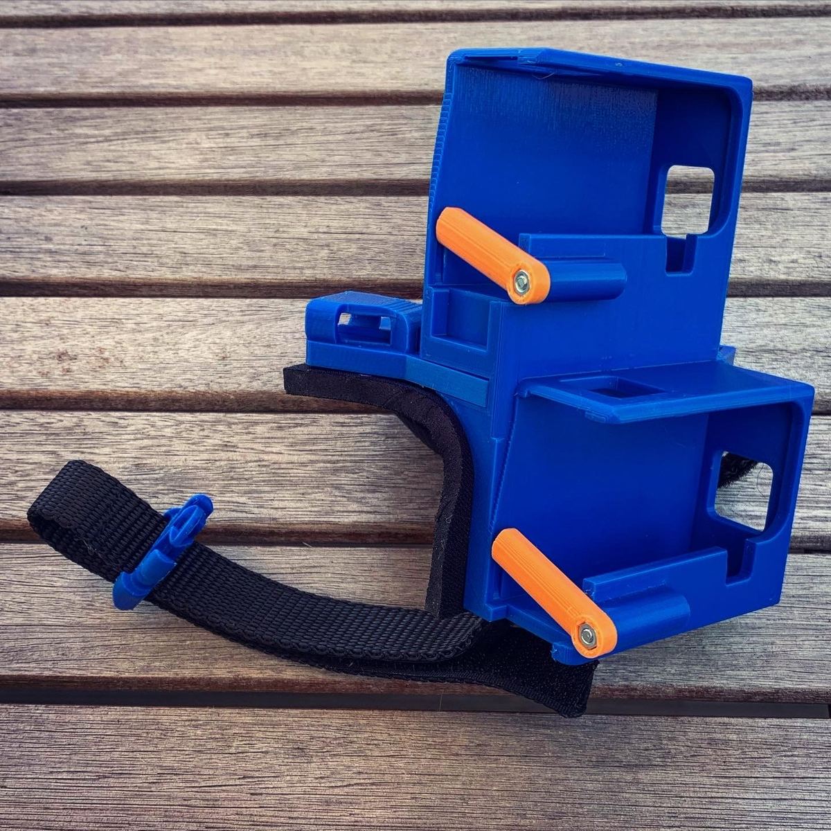 A Wristy Handycam glove in orange and blue