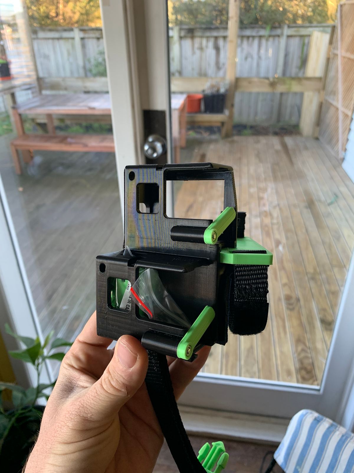 A Wristy Handycam Glove in Black and green