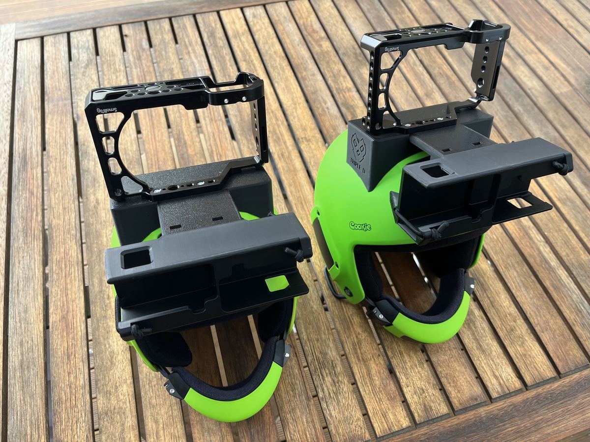 Two skydiving helmets fitted with custom 3D-printed camera mounts