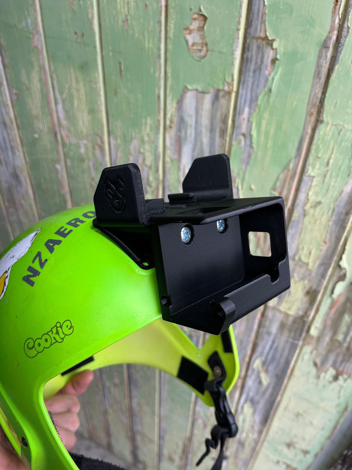 A 3D-printed camera mount fitted to a skydiving helmet