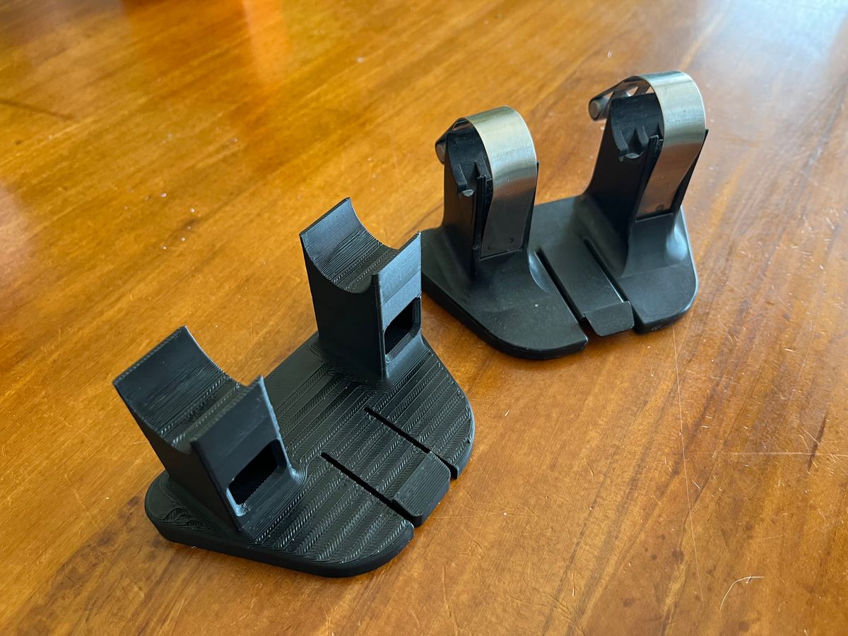 A 3D-printed replacement part next to the original part it was copied from